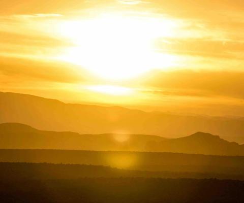 Depiction of hot weather with golden sun setting